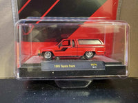 M2 Machines 1:64 1985 Toyota Truck with Camper Shell – Red- Hobby Exclusive