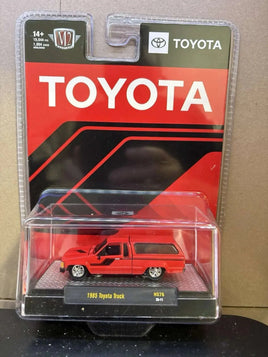 M2 Machines 1:64 1985 Toyota Truck with Camper Shell – Red- Hobby Exclusive